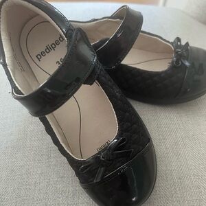 Pediped girl’s black Mary Jane dress shoe.
